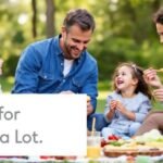 Family picnicking in a park, enjoying quality time together.